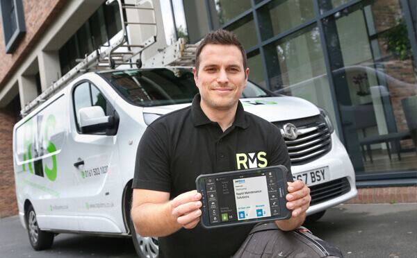 BigChange RMS paperless employee holding tablet