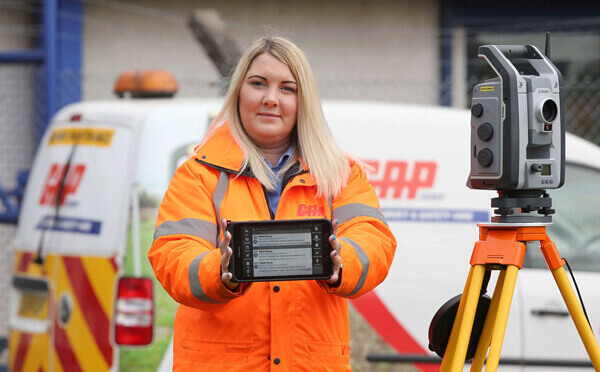 BigChange GAP hire lady holding tablet